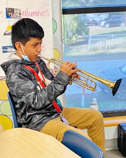 Eduardo playing the trumpet